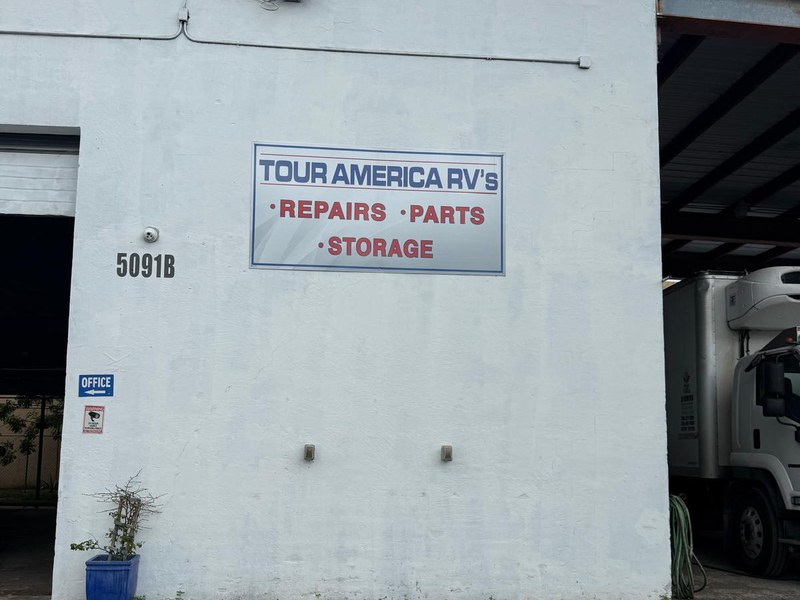 The Tour America RV's shop front in Doral with the Repairs, Parts, Storage sign